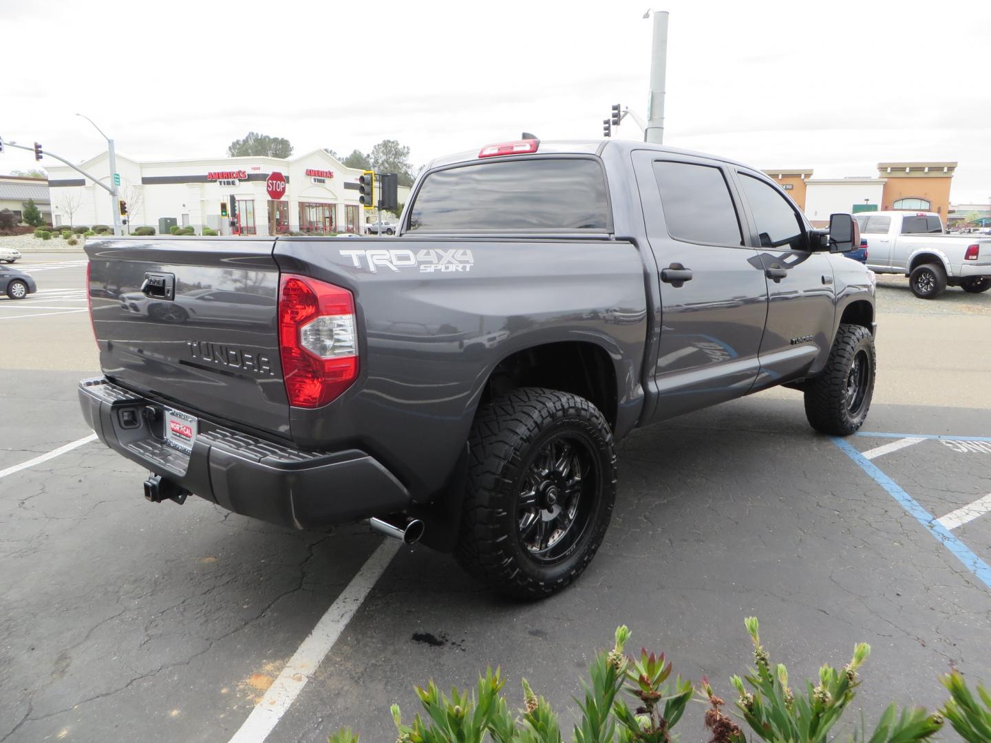 2021 CHARCOAL /GREY Toyota Tundra SR5 (5TFDY5F16MX) with an 5.7L V8 OHV 16V engine, automatic transmission, located at 2630 Grass Valley Highway, Auburn, CA, 95603, (530) 508-5100, 38.937893, -121.095482 - Features a Zone Offroad level kit, 20" SOTA wheels, 35" Nitto Ridge Grappler tires, Fox rear shocks, Air bags, front and rear TRD sway bars, and Window tint. - Photo#4